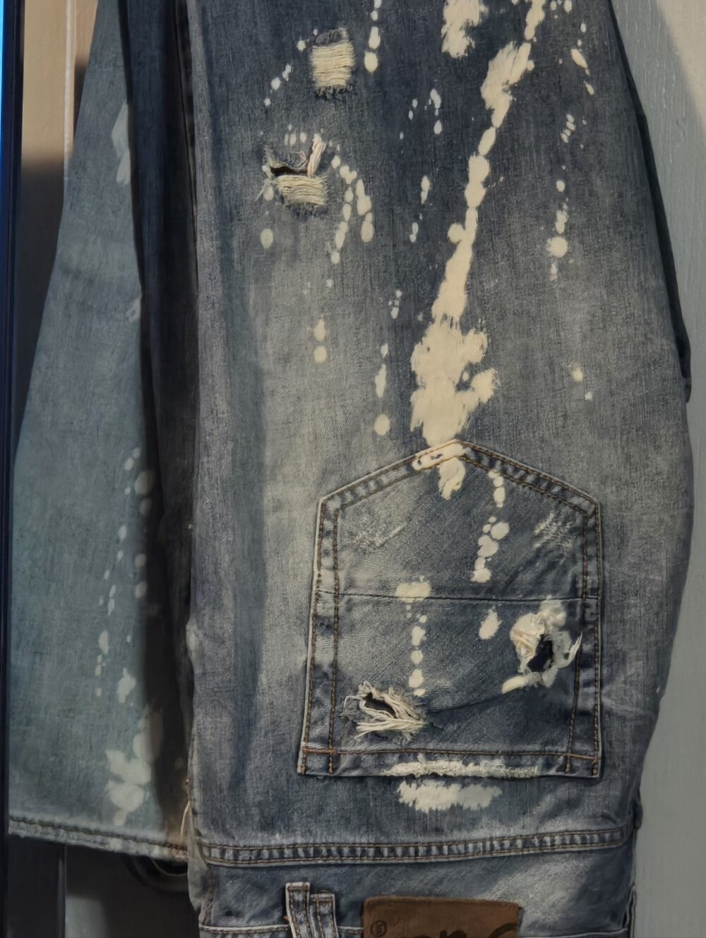 Men's Distressed Blue Denim Jeans with Bleach Splatter